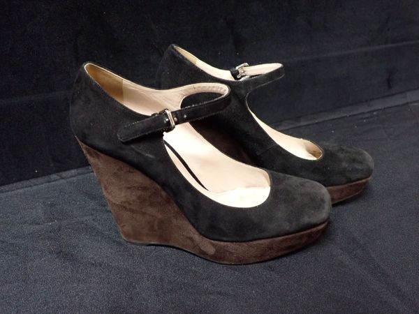 PRADA: A PAIR OF BLACK AND BROWN SUEDE WEDGE HEEL SHOES