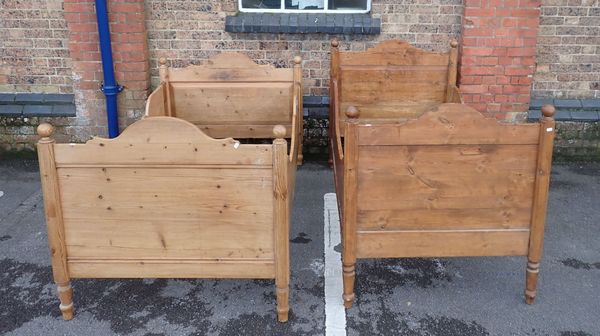 TWO SIMILAR 19TH CENTURY CONTINENTAL STRIPPED PINE BED FRAMES