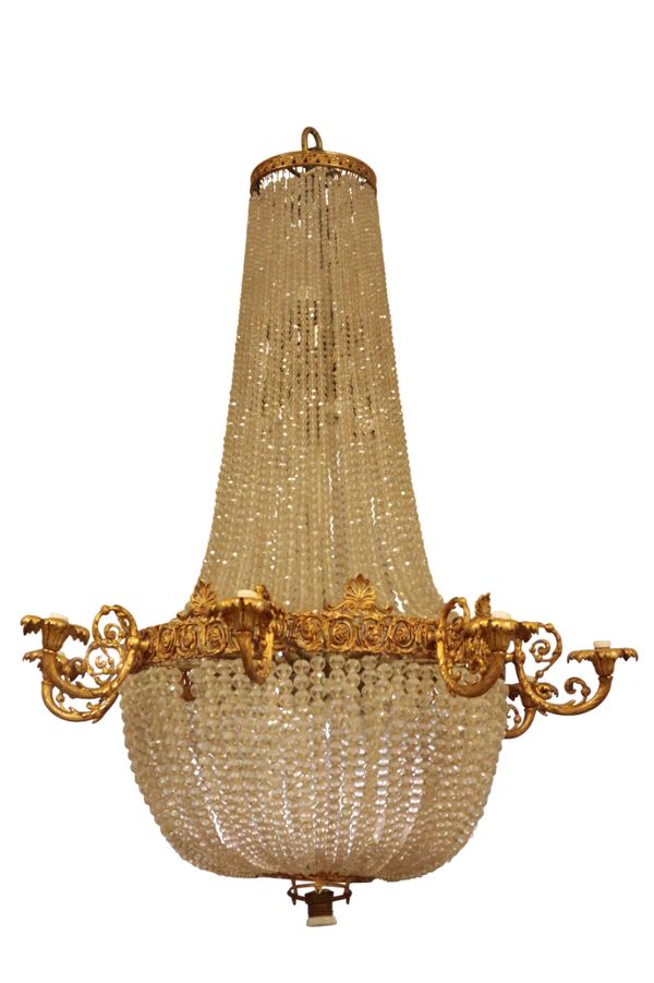 A REGENCY STYLE GILT METAL AND CUT GLASS EIGHT LIGHT CHANDELIER