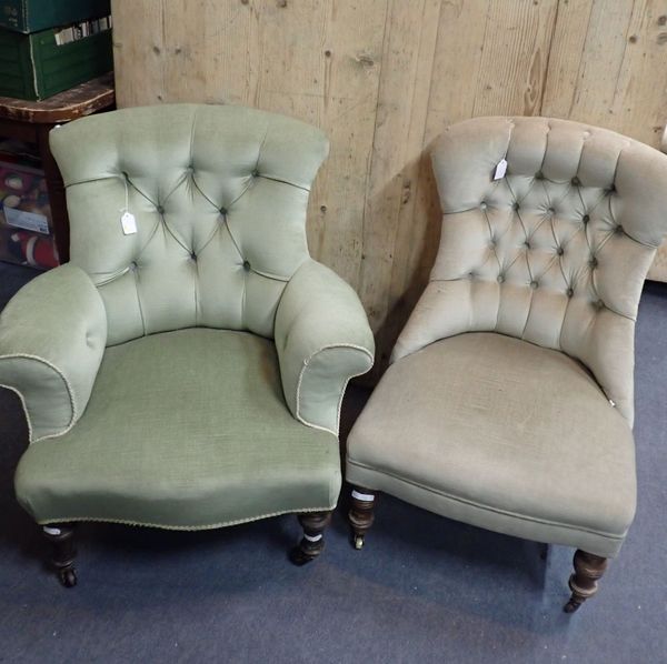 A VICTORIAN UPHOLSTERED ARMCHAIR WITH TURNED FRONT LEGS