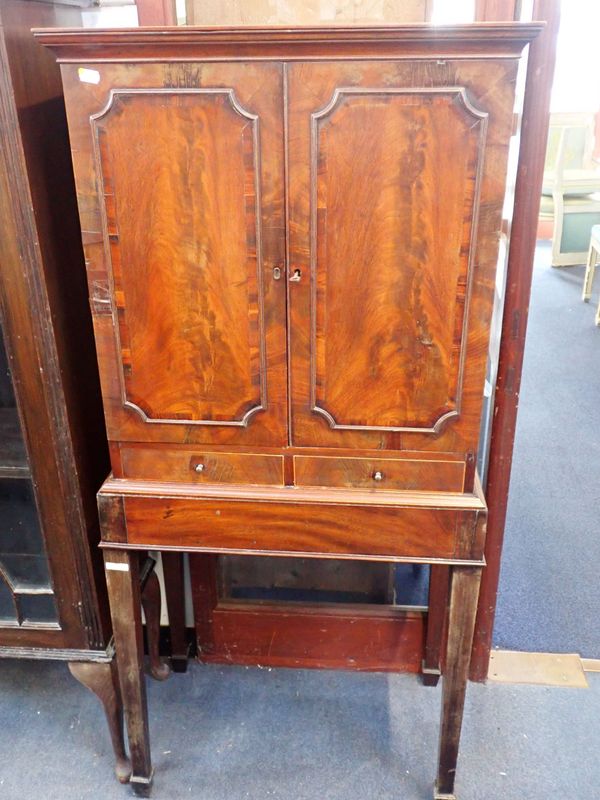 A 19TH CENTURY MAHOGANY CABINET ON STAND