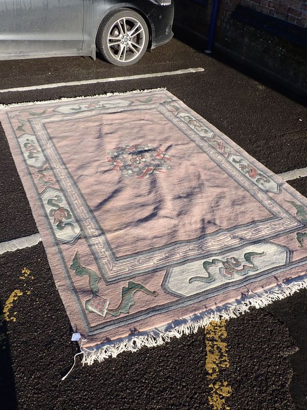 A PINK GROUND CHINESE RUG