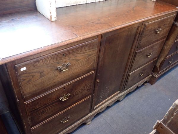 A LARGE OAK SIDEBOARD OR DRESSER