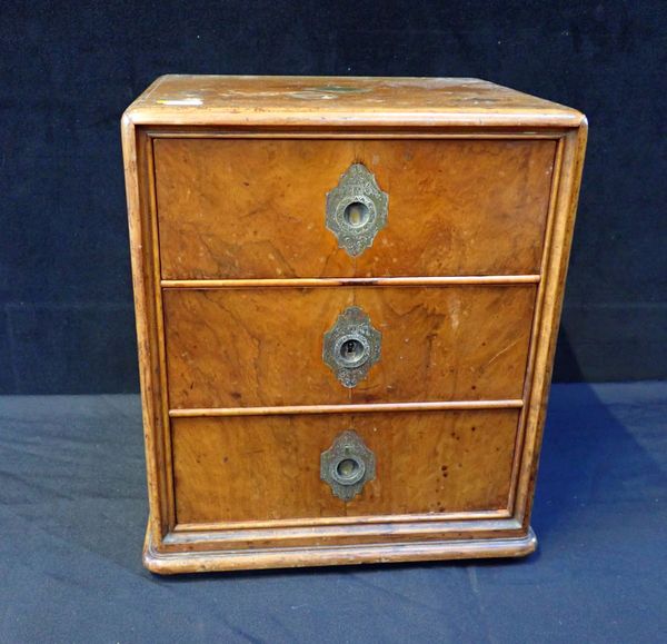 A VICTORIAN WALNUT THREE-DRAWER TABLE CABINET