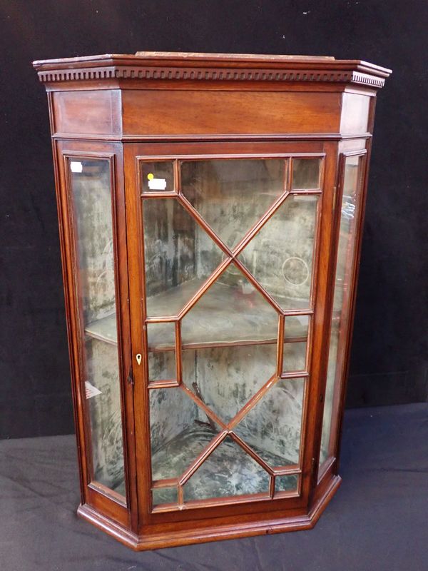 A SMALL EDWARDIAN GLAZED CORNER CABINET