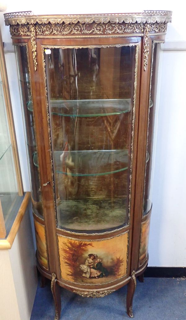 A CONTINENTAL BOWFRONTED  VITRINE
