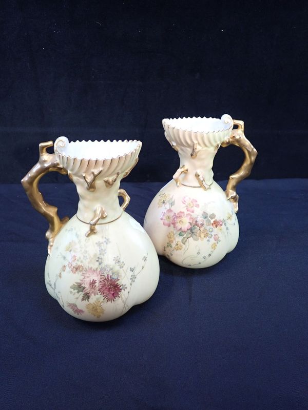 A PAIR OF ROYAL WORCESTER BLUSH IVORY JUGS