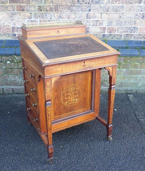 A LATE VICTORIAN ROSEWOOD AND MARQUETRY DAVENPORT