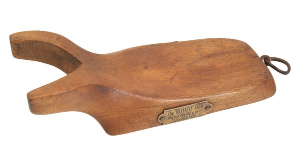 AN EDWARDIAN OAK BOOT JACK