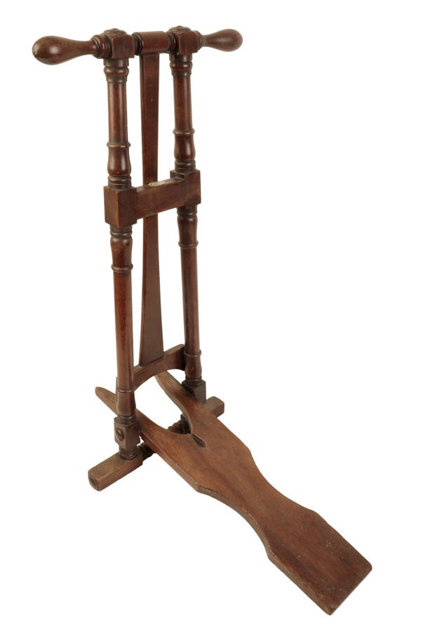 A MAHOGANY FREESTANDING BOOTJACK