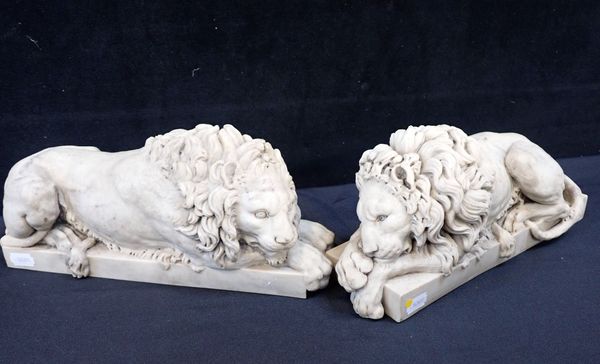 A PAIR OF CAST 'CHATSWORTH' LIONS, AFTER CANOVA