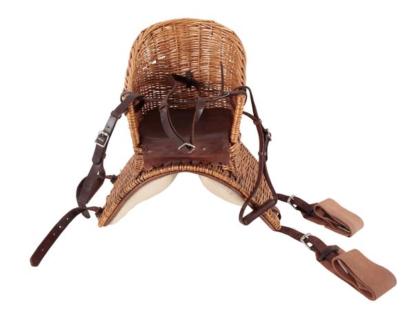 AN EDWARDIAN WICKER AND LEATHER CHILD'S BASKET SEAT