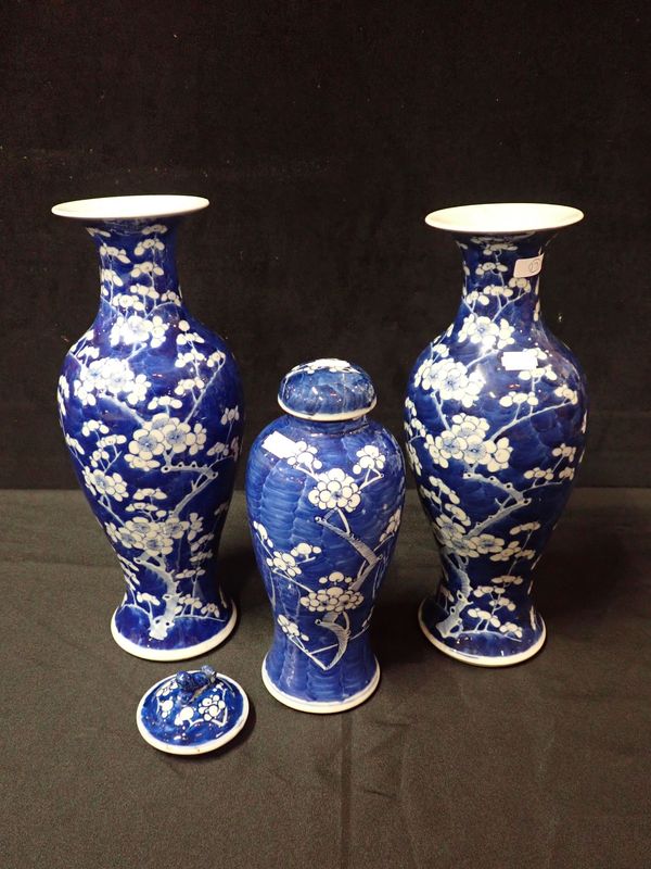 A PAIR OF BLUE AND WHITE CHINESE PRUNUS BLOSSOM VASES