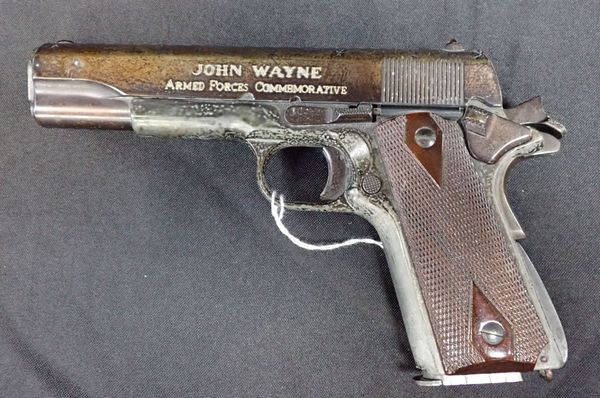 A JOHN WAYNE 45 GOVERNMENT COMMEMORATIVE GUN