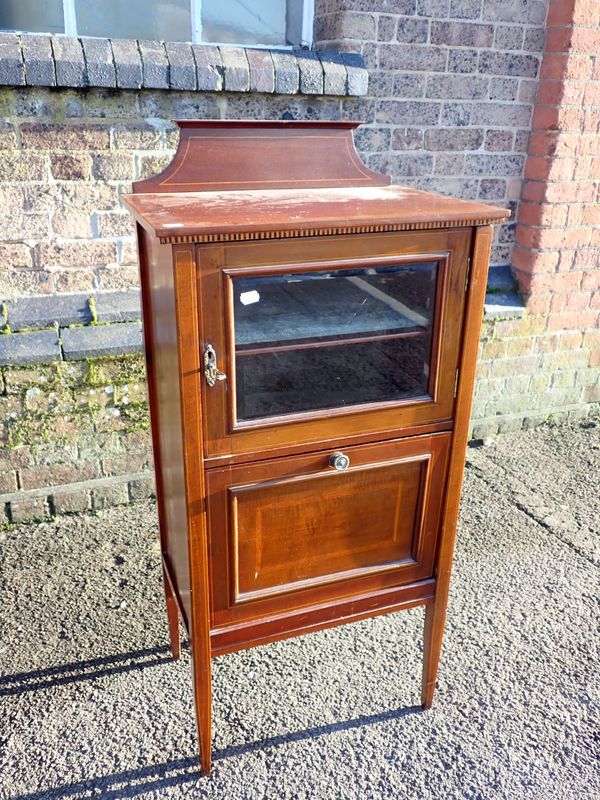 AN EDWARDIAN MAHOGANY MUSIC CABINET