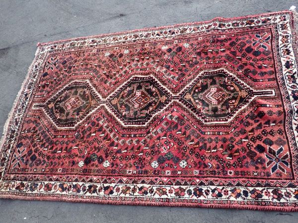 A THICK-PILE PERSIAN STYLE RUG