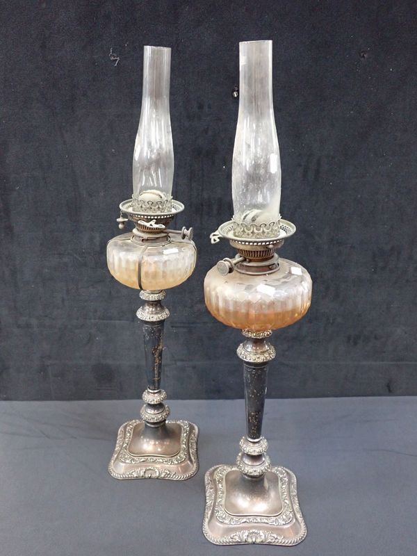 A PAIR OF VICTORIAN SILVER-PLATED OIL LAMPS