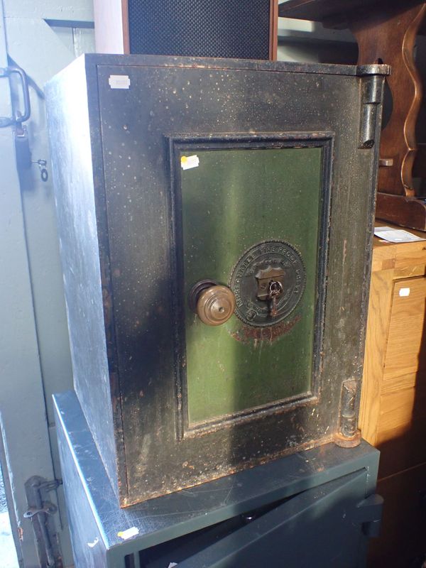 A CAST-IRON SAFE 'IMPREGNABLE FIRE-PROOF CHEST'