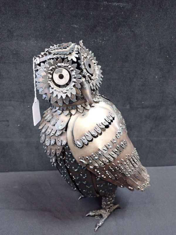 A DECORATIVE METAL OWL SCULPTURE