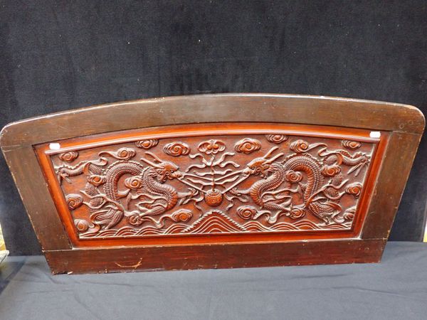 A CHINESE CARVED WOODEN PANEL