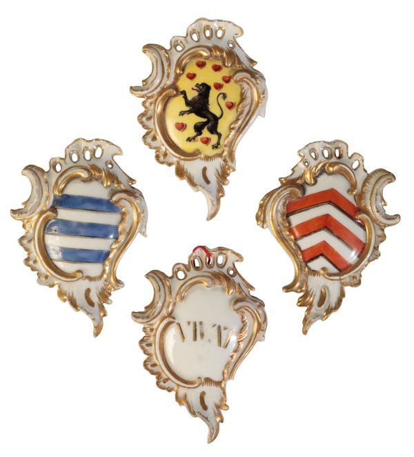 A SET OF FOUR MEISSEN ROCOCO ARMORIAL PLAQUES