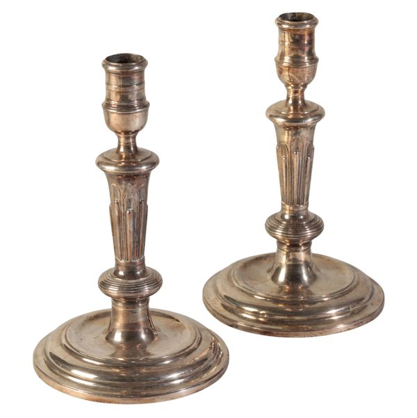 A PAIR OF REGENCE SILVER CANDLESTICKS