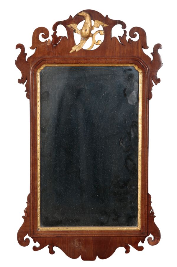 A GEORGE II STYLE MAHOGANY AND PARCEL GILT MIRROR