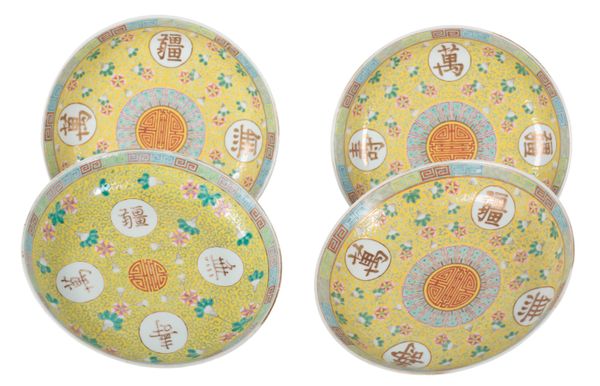 FOUR CHINESE FAMILE ROSE YELLOW GROUND PLATES