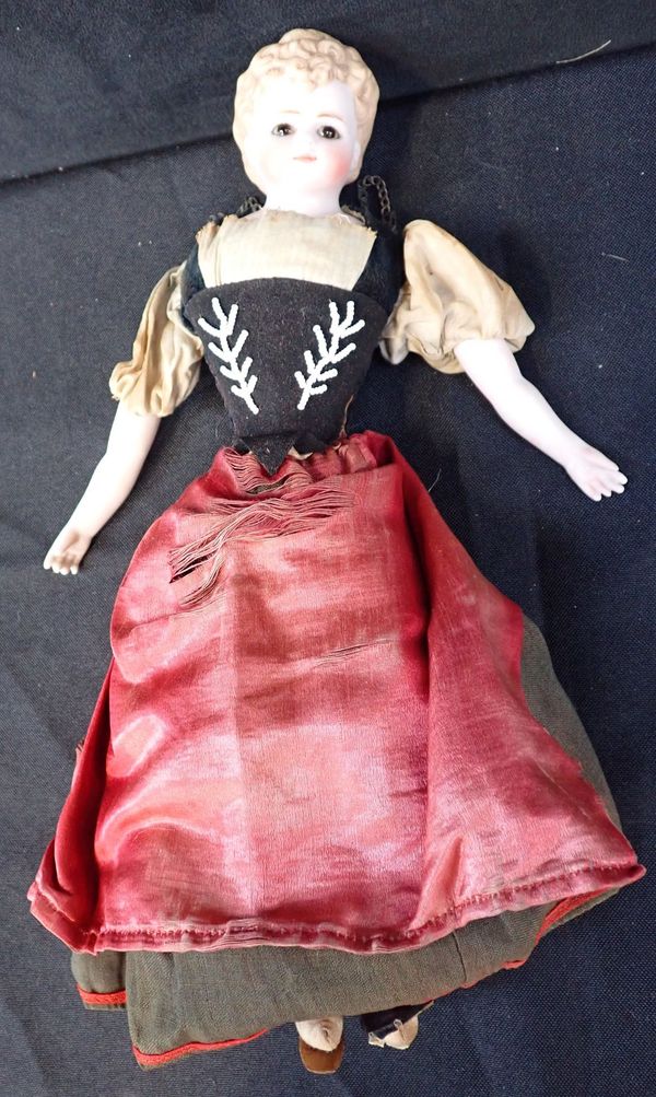 A 19TH CENTURY BISQUE HEAD DOLL