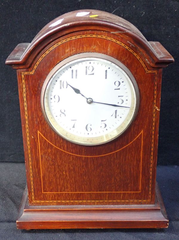 AN EDWARDIAN MAHOGANY MANTEL CLOCK