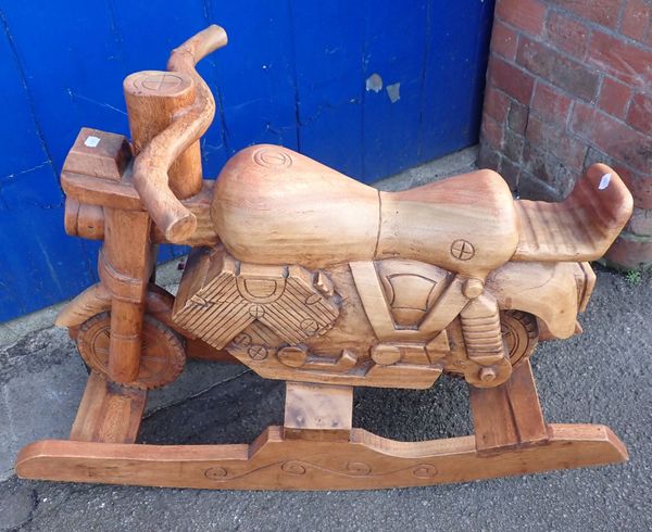 A CARVED HARDWOOD MOTORCYCLE