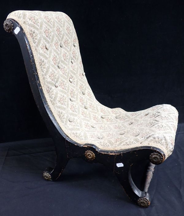 A VICTORIAN CHILD’S EBONISED SLIPPER CHAIR