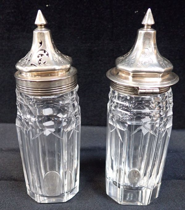 A PAIR OF SILVER MOUNTED CONDIMENT BOTTLES