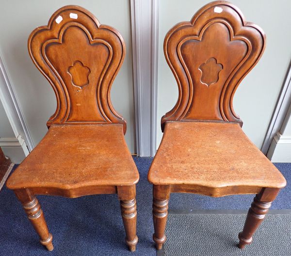 A PAIR OF VICTORIAN MAHOGANY HALL CHAIRS