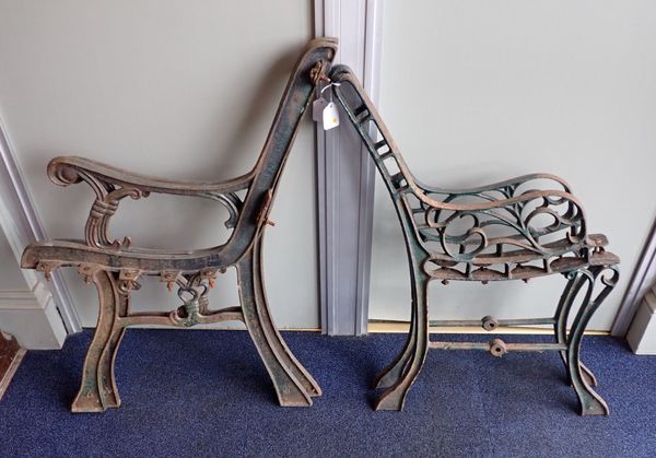 TWO PAIRS OF CAST IRON AND PAINTED BENCH ENDS
