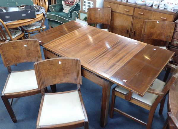 A 1950s MAHOGANY AND FIGURED WALNUT HARLEQUIN DINING SUITE OF ART DECO DESIGN