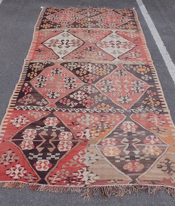 A LARGE KILIM CARPET