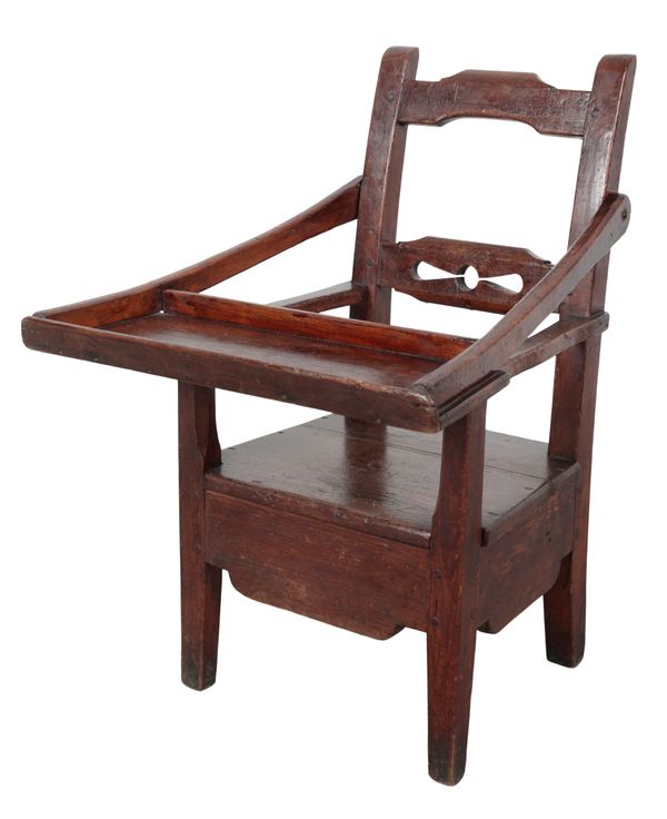 A PROVINCIAL STAINED PINE CHILD'S CHAIR WITH FOLDING TRAY