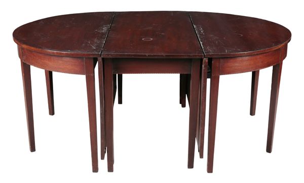 A GEORGE III MAHOGANY EXTENDING DINING TABLE