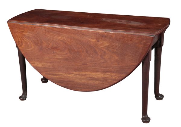 A GEORGE II MAHOGANY DROP LEAF DINING TABLE