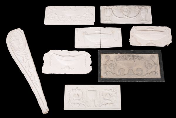A GROUP OF EIGHT PLASTER MOULDINGS OF ARCHITECTURAL FRIEZE