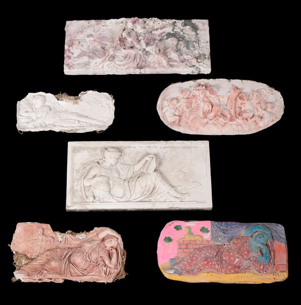 A GROUP OF SIX FIGURAL PLASTER RELIEFS