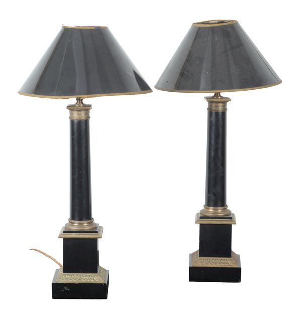A PAIR OF EBONISED AND GILT METAL MOUNTED COLUMNAR TABLE LAMPS