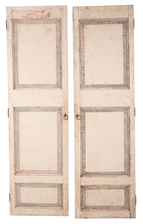 A LARGE PAIR OF WHITE-PAINTED AND DISTRESSED SHUTTERS OR DOORS