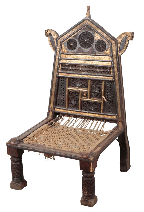 AN INDIAN CHIP CARVED AND METAL MOUNTED CHAIR