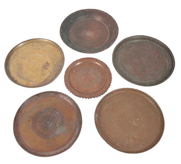 A GROUP OF SIX EASTERN COPPER AND BRASS CHARGERS