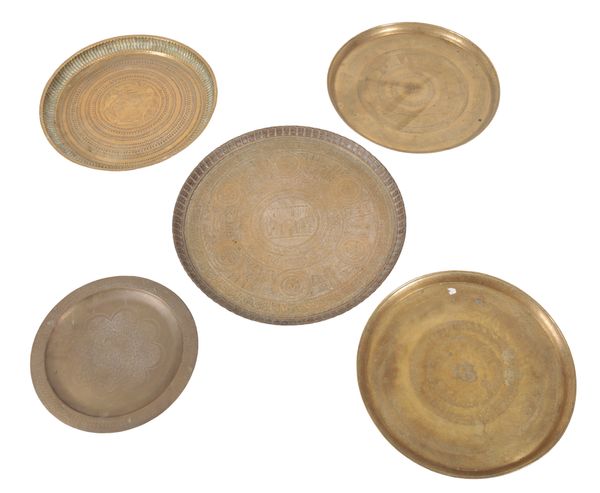A GROUP OF FIVE EASTERN BRASS CHARGERS