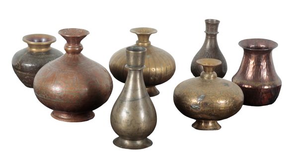 A GROUP OF SEVEN EASTERN BRASS AND COPPER VASES