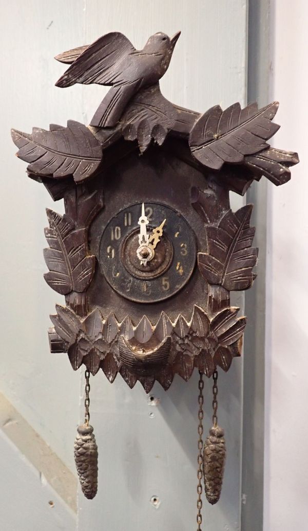 AN OLD BLACK FOREST WALL CLOCK