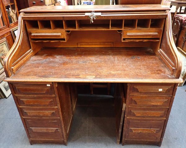 AN EDWARDIAN OAK 'ROLL-TOP' DESK